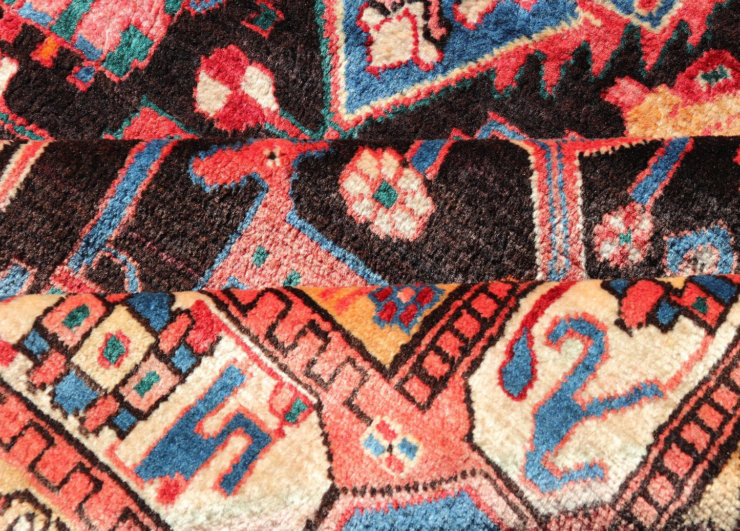 Antique Persian Nahavand Rug with All - Over Sub - Geometric Tribal Design Measures: 4'3 x 9'4. This absolutely stunning Antique Nahavand (circa 1920s) features a symmetrical sub - geometric design rendered in shades of reds, blues, greens, cre... - Keivan Woven ArtsV21 - 1103 - 18341