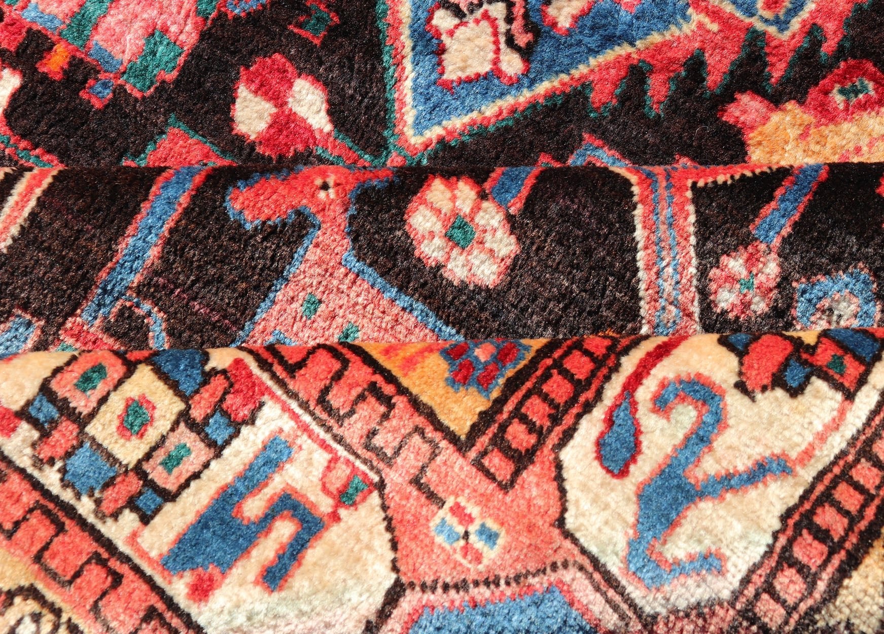 Antique Persian Nahavand Rug with All - Over Sub - Geometric Tribal Design Measures: 4'3 x 9'4. This absolutely stunning Antique Nahavand (circa 1920s) features a symmetrical sub - geometric design rendered in shades of reds, blues, greens, cre... - Keivan Woven ArtsV21 - 1103 - 18341
