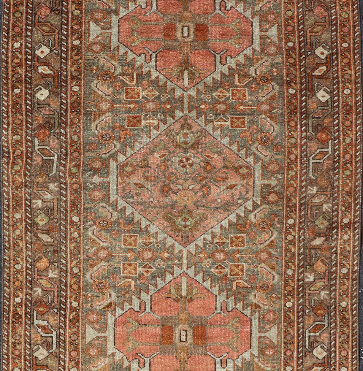 Antique Persian Hamedan in Rustic Earthy Tones With Tribal Medallions This antique hamadan features three medallions in the field, surrounded by sub - geometric tribal motifs. The complementary border displays a geometric tribal design, wrapp... - Keivan Woven ArtsV21 - 1201 - 18395