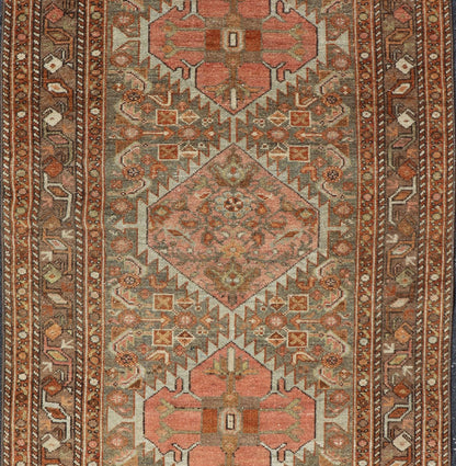 Antique Persian Hamedan in Rustic Earthy Tones With Tribal Medallions This antique hamadan features three medallions in the field, surrounded by sub - geometric tribal motifs. The complementary border displays a geometric tribal design, wrapp... - Keivan Woven ArtsV21 - 1201 - 18395