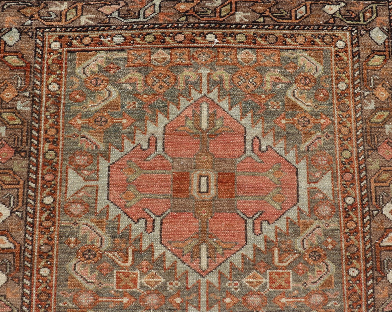 Antique Persian Hamedan in Rustic Earthy Tones With Tribal Medallions This antique hamadan features three medallions in the field, surrounded by sub - geometric tribal motifs. The complementary border displays a geometric tribal design, wrapp... - Keivan Woven ArtsV21 - 1201 - 18395Rug