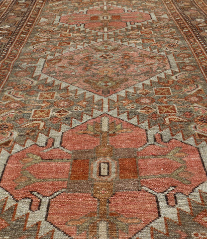 Antique Persian Hamedan in Rustic Earthy Tones With Tribal Medallions This antique hamadan features three medallions in the field, surrounded by sub - geometric tribal motifs. The complementary border displays a geometric tribal design, wrapp... - Keivan Woven ArtsV21 - 1201 - 18395Rug