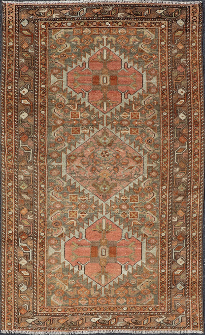 Antique Persian Hamedan in Rustic Earthy Tones With Tribal Medallions This antique hamadan features three medallions in the field, surrounded by sub - geometric tribal motifs. The complementary border displays a geometric tribal design, wrapp... - Keivan Woven ArtsV21 - 1201 - 18395Rug