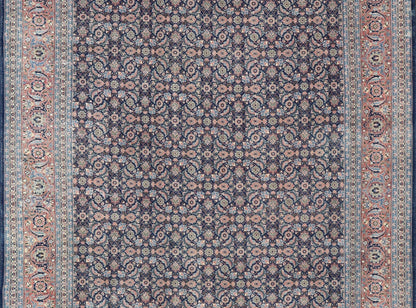 Antique Hand - Knotted Persian Tabriz with Sub - Geometric Floral Design in Wool This antique Persian Tabriz rug features an all - over, sub - geometric floral design rendered in green, coral, orange, ivory and blue shades, set upon a navy blue backgro... - Keivan Woven ArtsV21 - 1206 - 18431