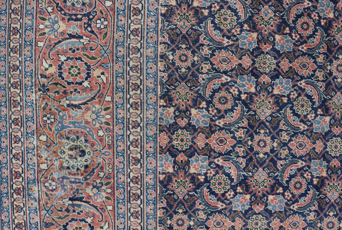 Antique Hand - Knotted Persian Tabriz with Sub - Geometric Floral Design in Wool This antique Persian Tabriz rug features an all - over, sub - geometric floral design rendered in green, coral, orange, ivory and blue shades, set upon a navy blue backgro... - Keivan Woven ArtsV21 - 1206 - 18431Rug