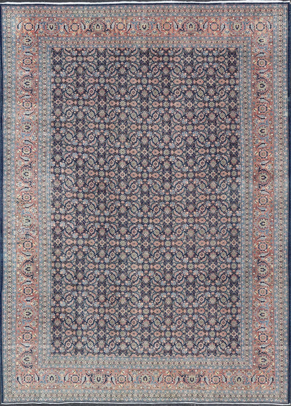 Antique Hand - Knotted Persian Tabriz with Sub - Geometric Floral Design in Wool This antique Persian Tabriz rug features an all - over, sub - geometric floral design rendered in green, coral, orange, ivory and blue shades, set upon a navy blue backgro... - Keivan Woven ArtsV21 - 1206 - 18431Rug