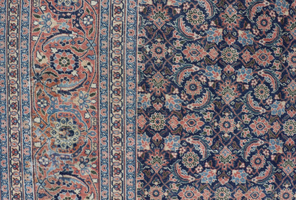 Antique Hand - Knotted Persian Tabriz with Sub - Geometric Floral Design in Wool This antique Persian Tabriz rug features an all - over, sub - geometric floral design rendered in green, coral, orange, ivory and blue shades, set upon a navy blue backgro... - Keivan Woven ArtsV21 - 1206 - 18431