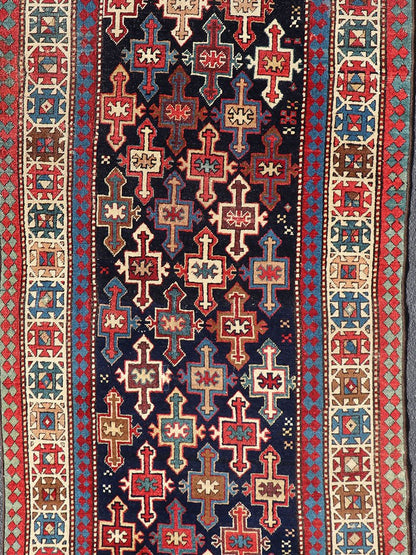 Late 19th Century Kazak Runner with Geometric Design in Tribal Crosses. Country of Origin: Caucasus Type: Kazak Design: All - Over, Sub - Geometric, Medallion Keivan Woven Arts; rug V21 - 1211 Measures; 3'3 x 9'1 This piece was hand - knotted in Caucasu... - Keivan Woven ArtsV21 - 1211 - 18485Rug