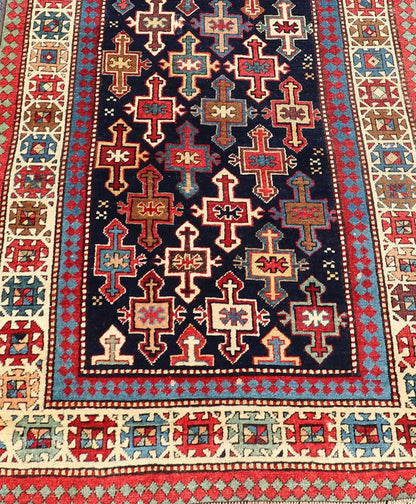 Late 19th Century Kazak Runner with Geometric Design in Tribal Crosses. Country of Origin: Caucasus Type: Kazak Design: All - Over, Sub - Geometric, Medallion Keivan Woven Arts; rug V21 - 1211 Measures; 3'3 x 9'1 This piece was hand - knotted in Caucasu... - Keivan Woven ArtsV21 - 1211 - 18485Rug