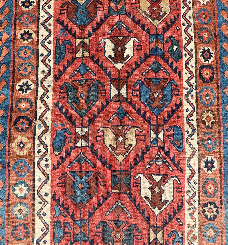 Late 19th Century Kazak Runner featuring All - Over, Geometric Tribal Motifs This late 19th - century treasure is rendered in red, brick, blue, ivory, sandy taupe, and small accents in salmon. The multi - tier border displays tribal - like patterns and sta... - Keivan Woven ArtsV21 - 1213 - 18493Rug