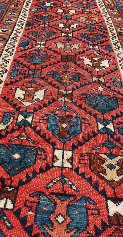 Late 19th Century Kazak Runner featuring All - Over, Geometric Tribal Motifs This late 19th - century treasure is rendered in red, brick, blue, ivory, sandy taupe, and small accents in salmon. The multi - tier border displays tribal - like patterns and sta... - Keivan Woven ArtsV21 - 1213 - 18493Rug