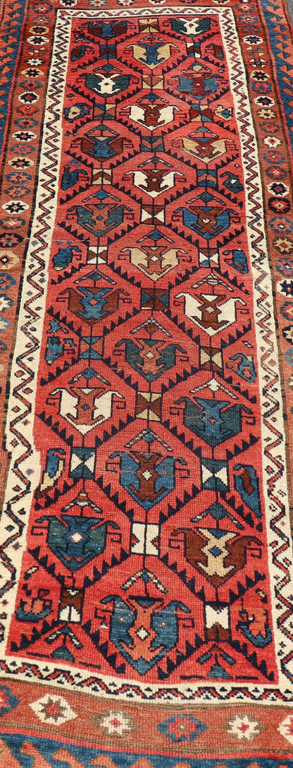 Late 19th Century Kazak Runner featuring All - Over, Geometric Tribal Motifs This late 19th - century treasure is rendered in red, brick, blue, ivory, sandy taupe, and small accents in salmon. The multi - tier border displays tribal - like patterns and sta... - Keivan Woven ArtsV21 - 1213 - 18493Rug