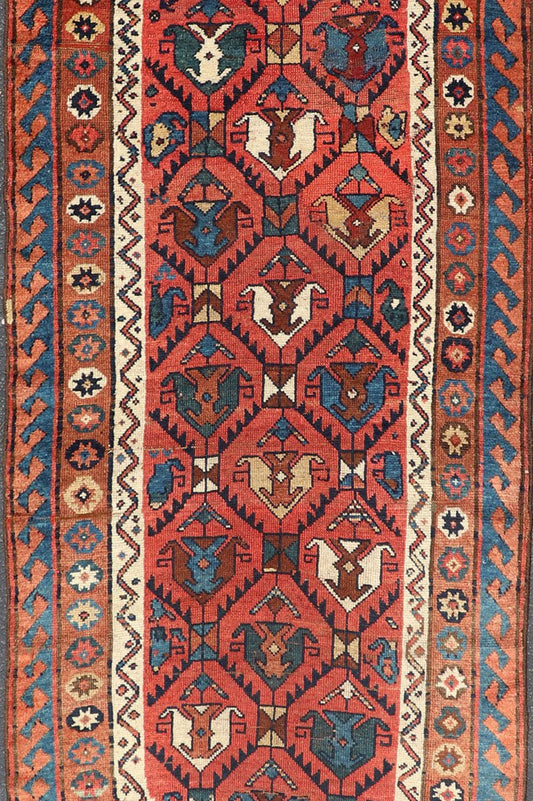 Late 19th Century Kazak Runner featuring All - Over, Geometric Tribal Motifs This late 19th - century treasure is rendered in red, brick, blue, ivory, sandy taupe, and small accents in salmon. The multi - tier border displays tribal - like patterns and sta... - Keivan Woven ArtsV21 - 1213 - 18493Rug