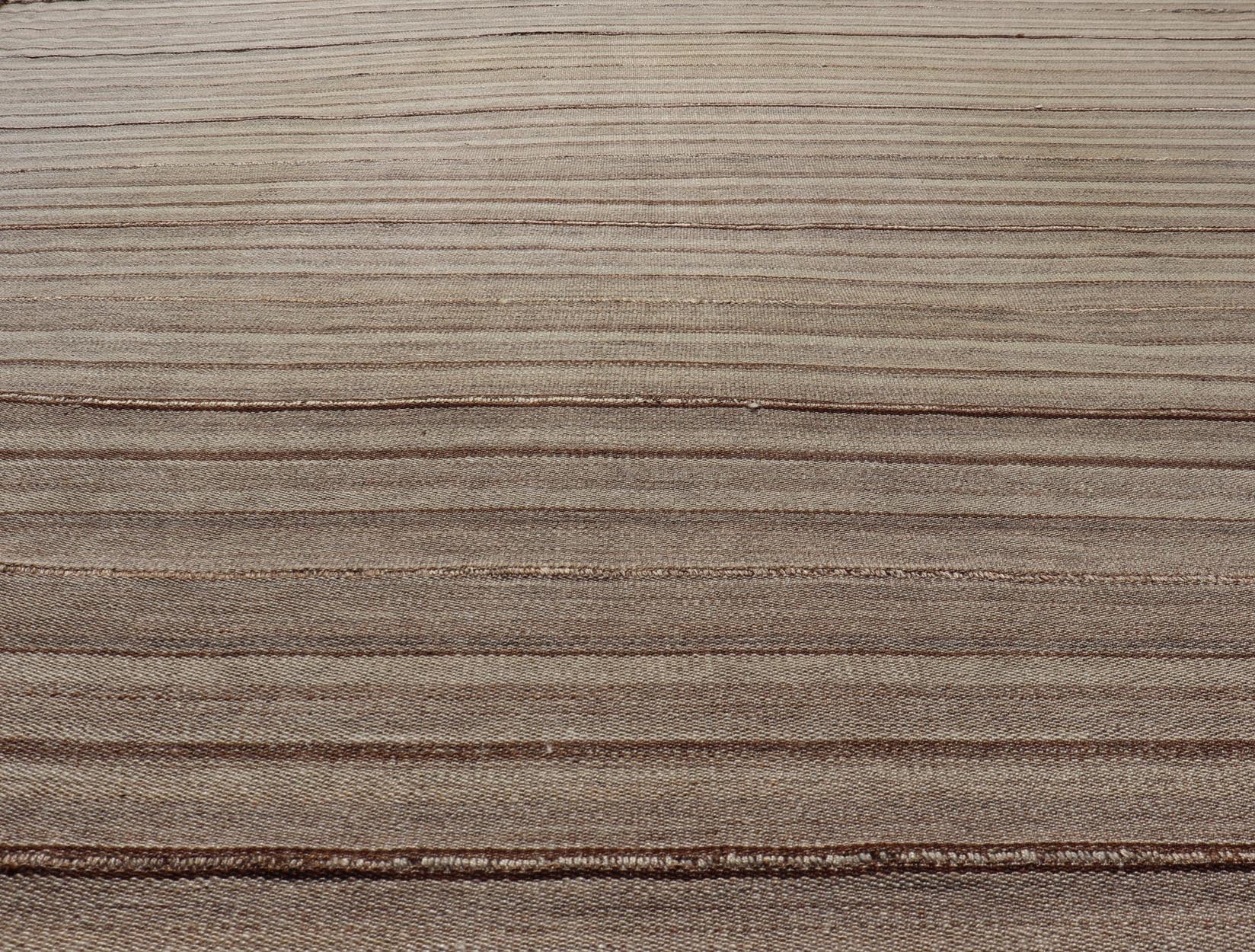 Square Antique Hand - Woven Persian Kilim Rug in Wool with Striped Design This Square flat - weave tribal Persian kilim has been hand - woven in wool. The rug features an all - over striped design, and is rendered in earthy tones; making this rug a sup... - Keivan Woven ArtsV21 - 211025 - 14764