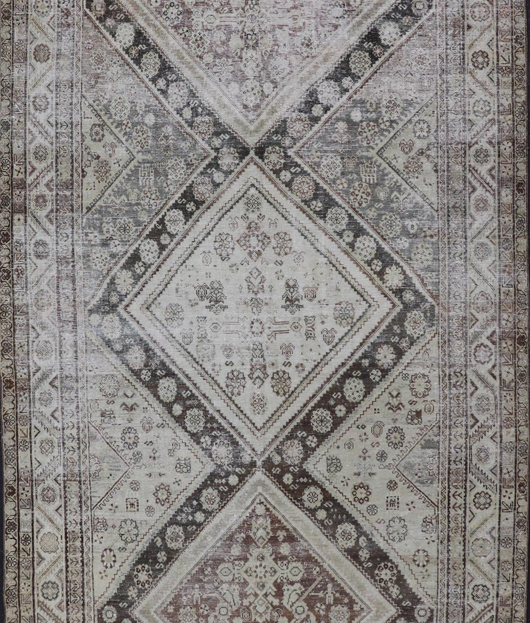 Antique Persian Mahal Gallery Rug with Medallion Design in Cream and Browns This antique Persian Mahal gallery rug has been hand - knotted in wool and features an all - over sub - geometric medallion design rendered in multicolor. A complementary, mu... - Keivan Woven ArtsVAS - 5 - 13988 - 17400Rug