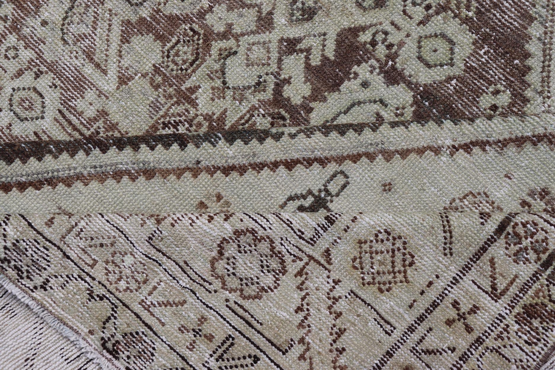 Antique Persian Mahal Gallery Rug with Medallion Design in Cream and Browns This antique Persian Mahal gallery rug has been hand - knotted in wool and features an all - over sub - geometric medallion design rendered in multicolor. A complementary, mu... - Keivan Woven ArtsVAS - 5 - 13988 - 17400Rug