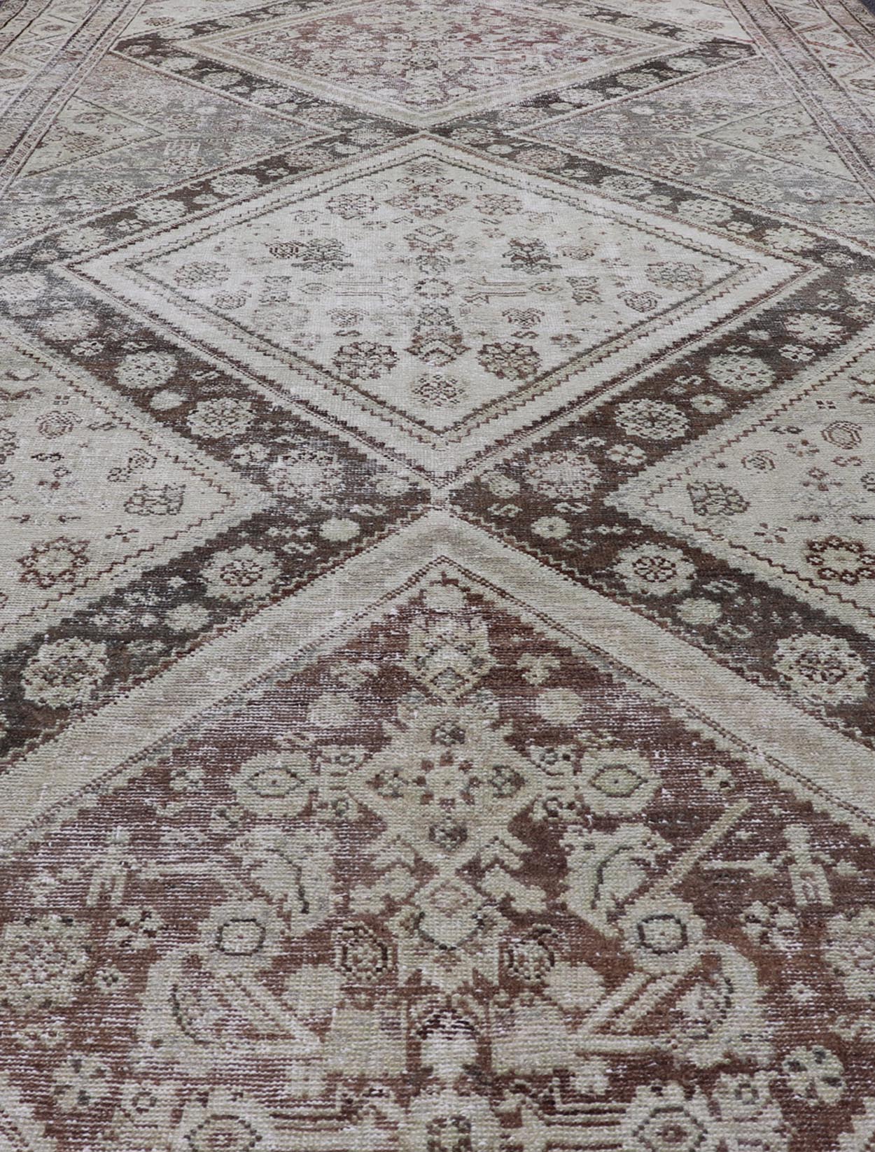 Antique Persian Mahal Gallery Rug with Medallion Design in Cream and Browns This antique Persian Mahal gallery rug has been hand - knotted in wool and features an all - over sub - geometric medallion design rendered in multicolor. A complementary, mu... - Keivan Woven ArtsVAS - 5 - 13988 - 17400Rug