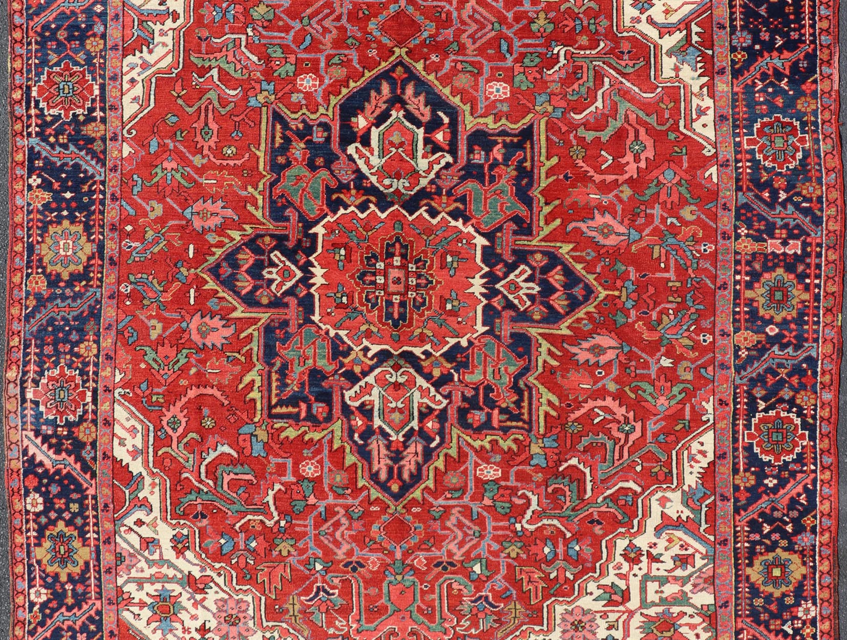 Antique Heriz Carpet with Stylized Central Medallion Set on Tomato Red Field. Antique Heriz Carpet with Stylized Central Medallion Set on Tomato Red Field. Keivan Woven Arts / Rug / VR - 8759 / country of origin / type: Persian / Serapi, circa ea... - Keivan Woven ArtsVR - 8759 - 1 - 24745Rugs