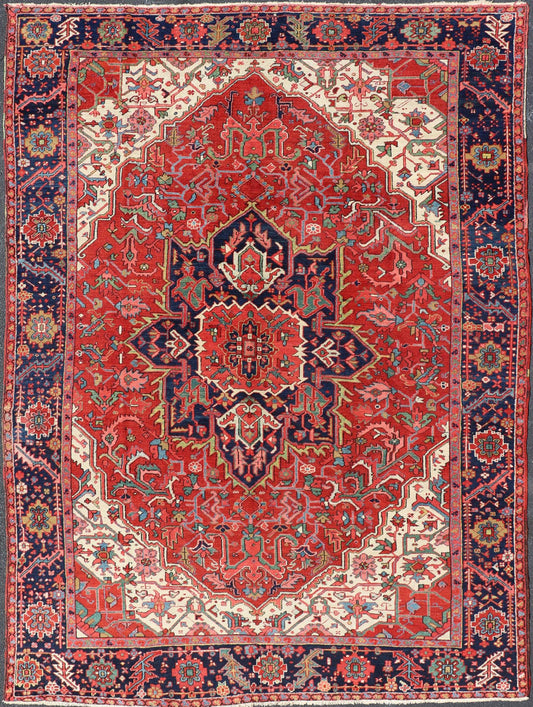 Antique Heriz Carpet with Stylized Central Medallion Set on Tomato Red Field. Antique Heriz Carpet with Stylized Central Medallion Set on Tomato Red Field. Keivan Woven Arts / Rug / VR - 8759 / country of origin / type: Persian / Serapi, circa ea... - Keivan Woven ArtsVR - 8759 - 1 - 24745Rugs