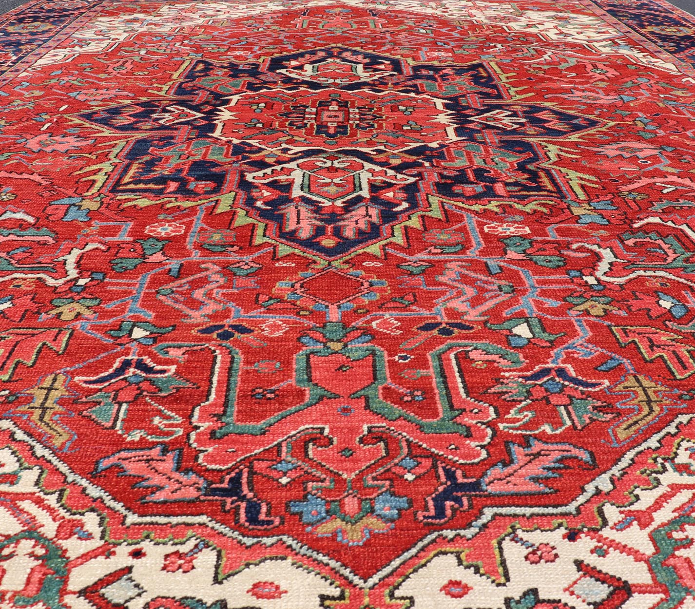 Antique Heriz Carpet with Stylized Central Medallion Set on Tomato Red Field. Antique Heriz Carpet with Stylized Central Medallion Set on Tomato Red Field. Keivan Woven Arts / Rug / VR - 8759 / country of origin / type: Persian / Serapi, circa ea... - Keivan Woven ArtsVR - 8759 - 1 - 24745Rugs