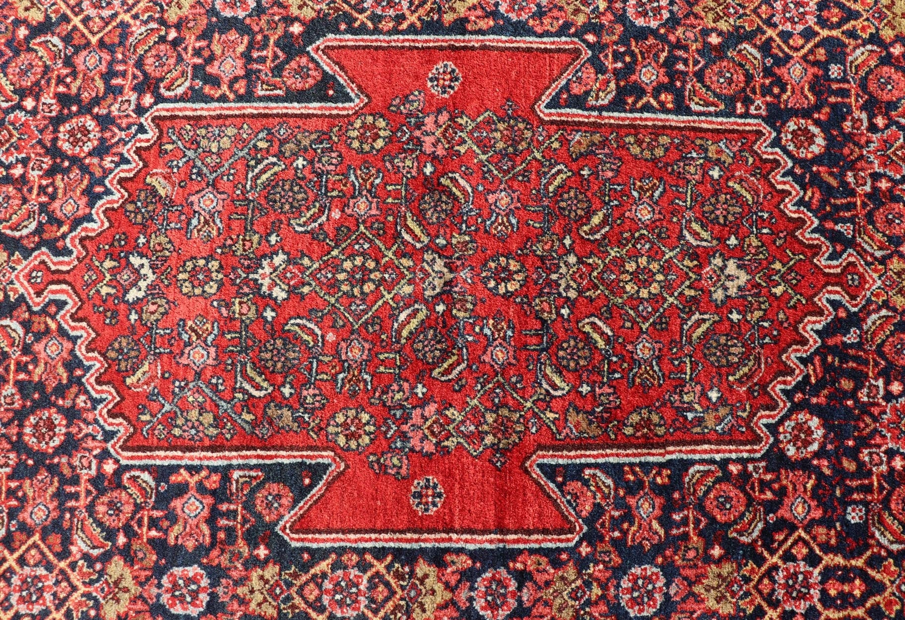 Antique Persian Bidjar Medallion Designed Carpet with of Blue's, Red, and Pink Measures: 4'5 x 6'7 The rug has a central medallion, surrounded by an intricate floral Herati design. The border utilizes softer colors of pink, blue and yel... - Keivan Woven ArtsW22 - 0102 - 18577