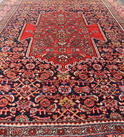 Antique Persian Bidjar Medallion Designed Carpet with of Blue's, Red, and Pink Measures: 4'5 x 6'7 The rug has a central medallion, surrounded by an intricate floral Herati design. The border utilizes softer colors of pink, blue and yel... - Keivan Woven ArtsW22 - 0102 - 18577