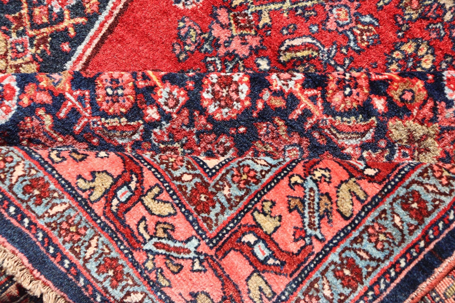 Antique Persian Bidjar Medallion Designed Carpet with of Blue's, Red, and Pink Measures: 4'5 x 6'7 The rug has a central medallion, surrounded by an intricate floral Herati design. The border utilizes softer colors of pink, blue and yel... - Keivan Woven ArtsW22 - 0102 - 18577