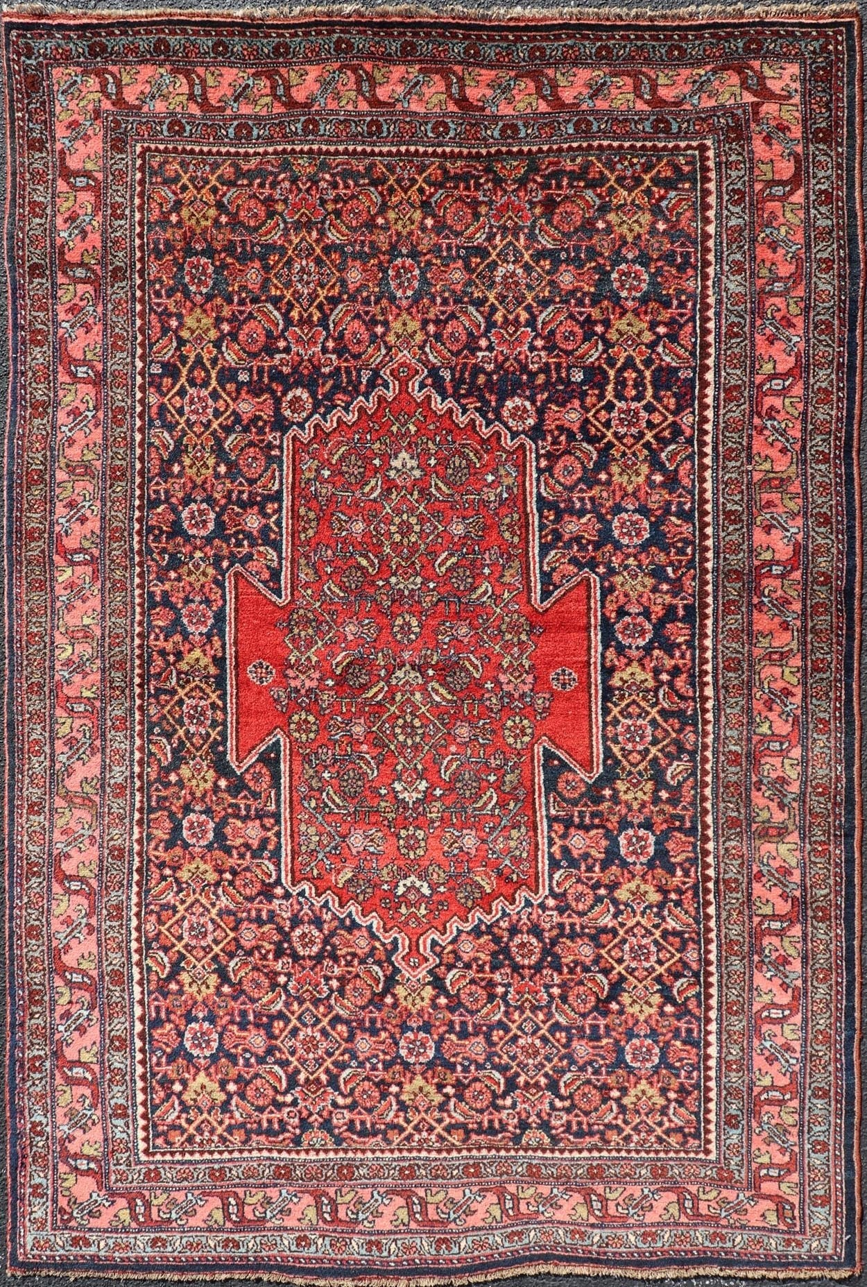 Antique Persian Bidjar Medallion Designed Carpet with of Blue's, Red, and Pink Measures: 4'5 x 6'7 The rug has a central medallion, surrounded by an intricate floral Herati design. The border utilizes softer colors of pink, blue and yel... - Keivan Woven ArtsW22 - 0102 - 18577