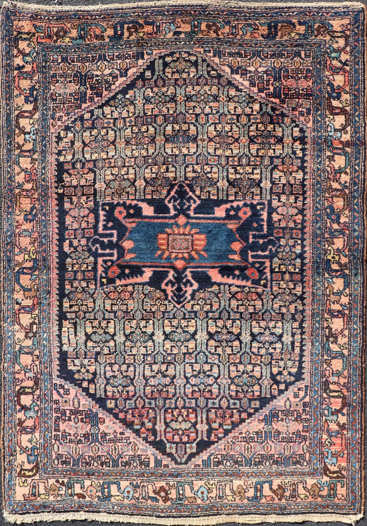Antique Bibiakabad Rug with Layered Medallion and Geometric Design in Background Blue, dark blue, pink, and tan Bibiakabad antique rug Persian, Keivan Woven Arts / rug W22 - 0103, country of origin / type: Iran / Bibiakabad , circa 1920. ... - Keivan Woven ArtsW22 - 0103 - 18583