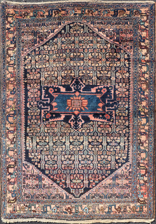 Antique Bibiakabad Rug with Layered Medallion and Geometric Design in Background Blue, dark blue, pink, and tan Bibiakabad antique rug Persian, Keivan Woven Arts / rug W22 - 0103, country of origin / type: Iran / Bibiakabad , circa 1920. ... - Keivan Woven ArtsW22 - 0103 - 18583