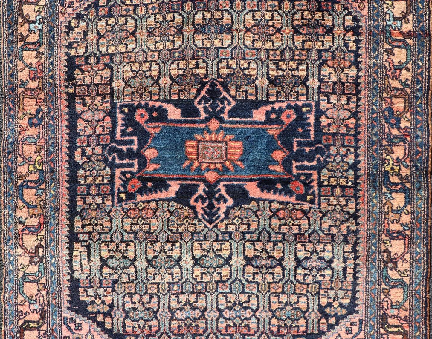 Antique Bibiakabad Rug with Layered Medallion and Geometric Design in Background Blue, dark blue, pink, and tan Bibiakabad antique rug Persian, Keivan Woven Arts / rug W22 - 0103, country of origin / type: Iran / Bibiakabad , circa 1920. ... - Keivan Woven ArtsW22 - 0103 - 18583