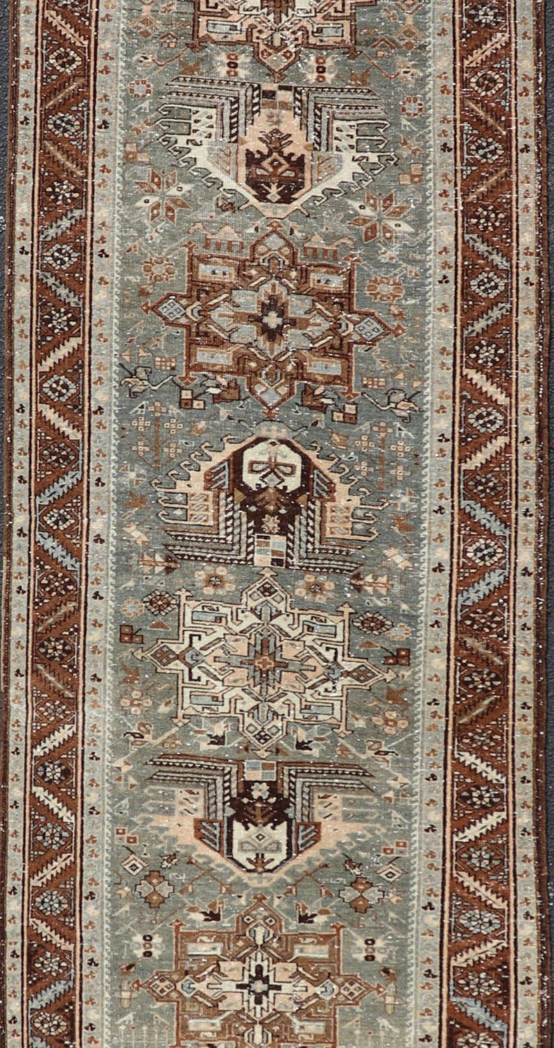 Antique Persian Heriz Runner in Wool with Geometric Medallions in gray Blue, light gray green and Brown. Keivan Woven Arts; rug W22 - 0107, country of origin / type: Iran / Heriz, circa 1920. Measures: 3'2 x 14'4 This antique Persian Heriz... - Keivan Woven ArtsW22 - 0107 - 19064