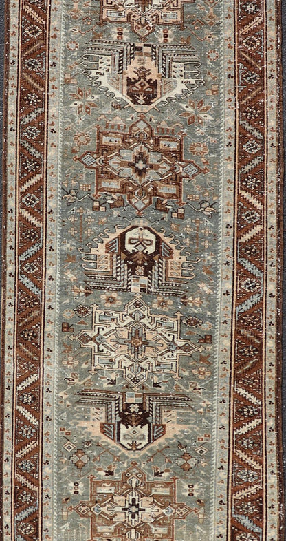 Antique Persian Heriz Runner in Wool with Geometric Medallions in gray Blue, light gray green and Brown. Keivan Woven Arts; rug W22 - 0107, country of origin / type: Iran / Heriz, circa 1920. Measures: 3'2 x 14'4 This antique Persian Heriz... - Keivan Woven ArtsW22 - 0107 - 19064