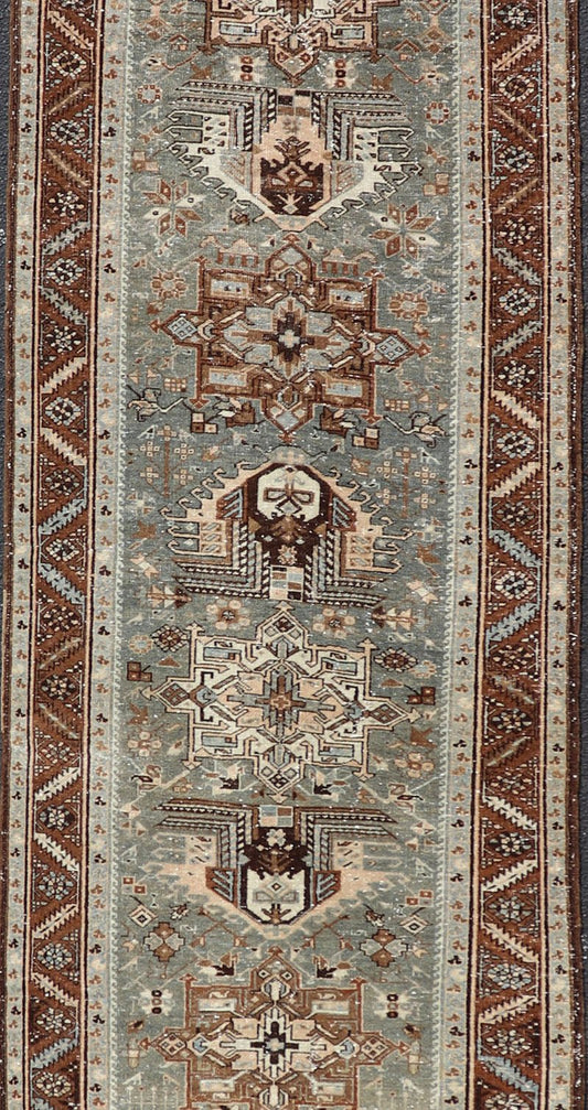 Antique Persian Heriz Runner in Wool with Geometric Medallions in gray Blue, light gray green and Brown. Keivan Woven Arts; rug W22 - 0107, country of origin / type: Iran / Heriz, circa 1920. Measures: 3'2 x 14'4 This antique Persian Heriz... - Keivan Woven ArtsW22 - 0107 - 19064