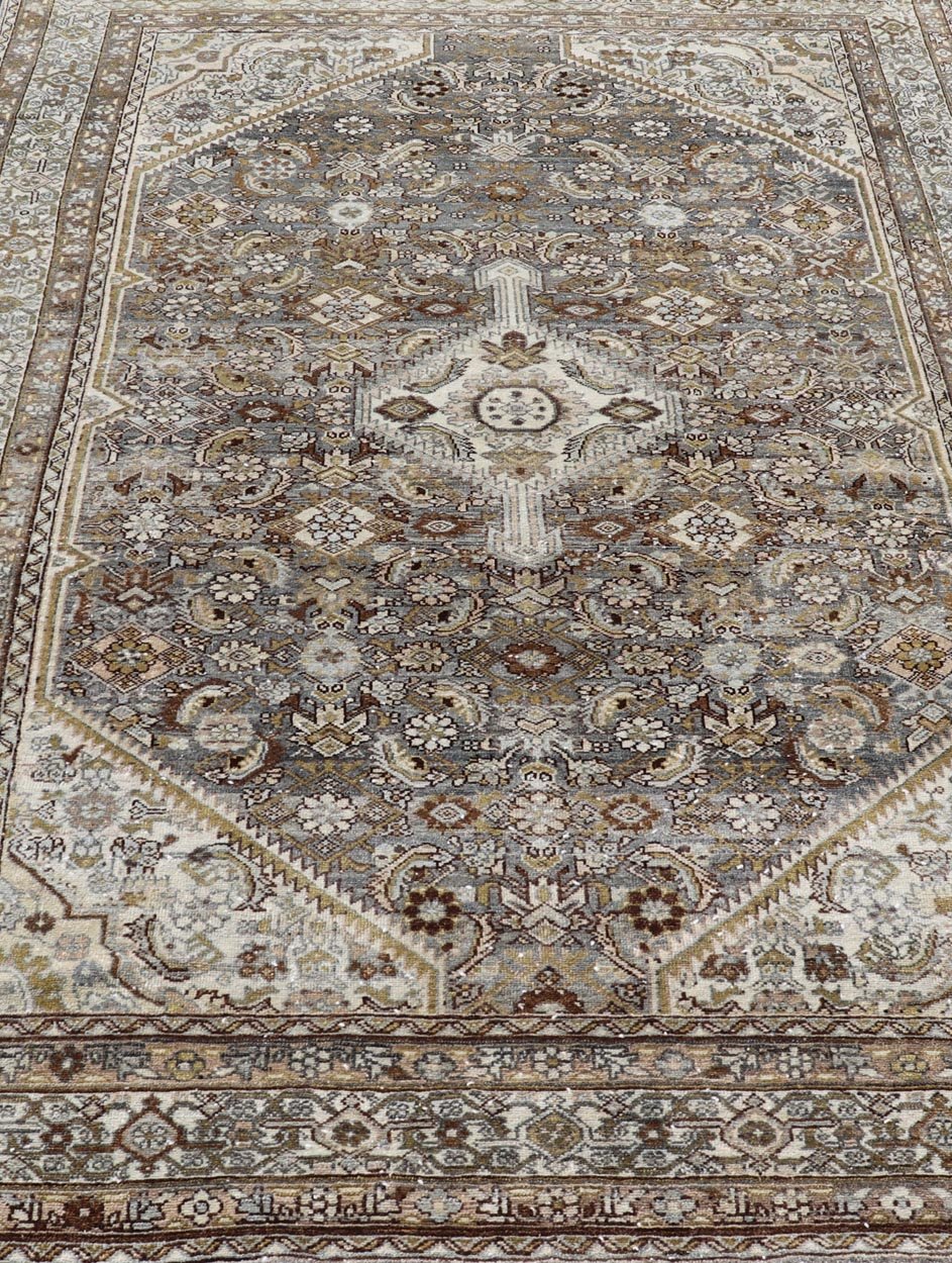 Antique Persian Bibikabad Carpet with Steal Blue, Charcoal, Green, and Brown. Keivan Woven Arts / rug W22 - 0108, country of origin / type: Iran / Bibikabad, circa 1920. Measures: 6'2 x 9'2 This antique Persian Bibikabad carpet, from t... - Keivan Woven ArtsW22 - 0108 - 19070