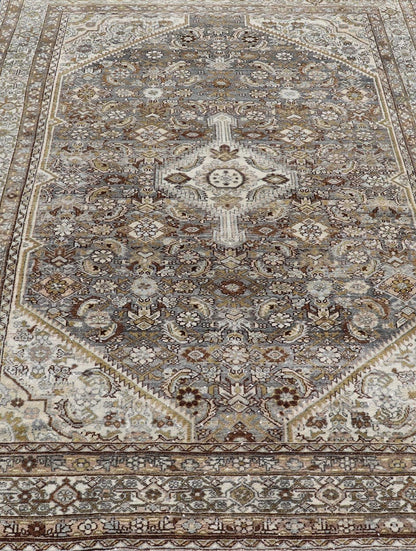 Antique Persian Bibikabad Carpet with Steal Blue, Charcoal, Green, and Brown. Keivan Woven Arts / rug W22 - 0108, country of origin / type: Iran / Bibikabad, circa 1920. Measures: 6'2 x 9'2 This antique Persian Bibikabad carpet, from t... - Keivan Woven ArtsW22 - 0108 - 19070