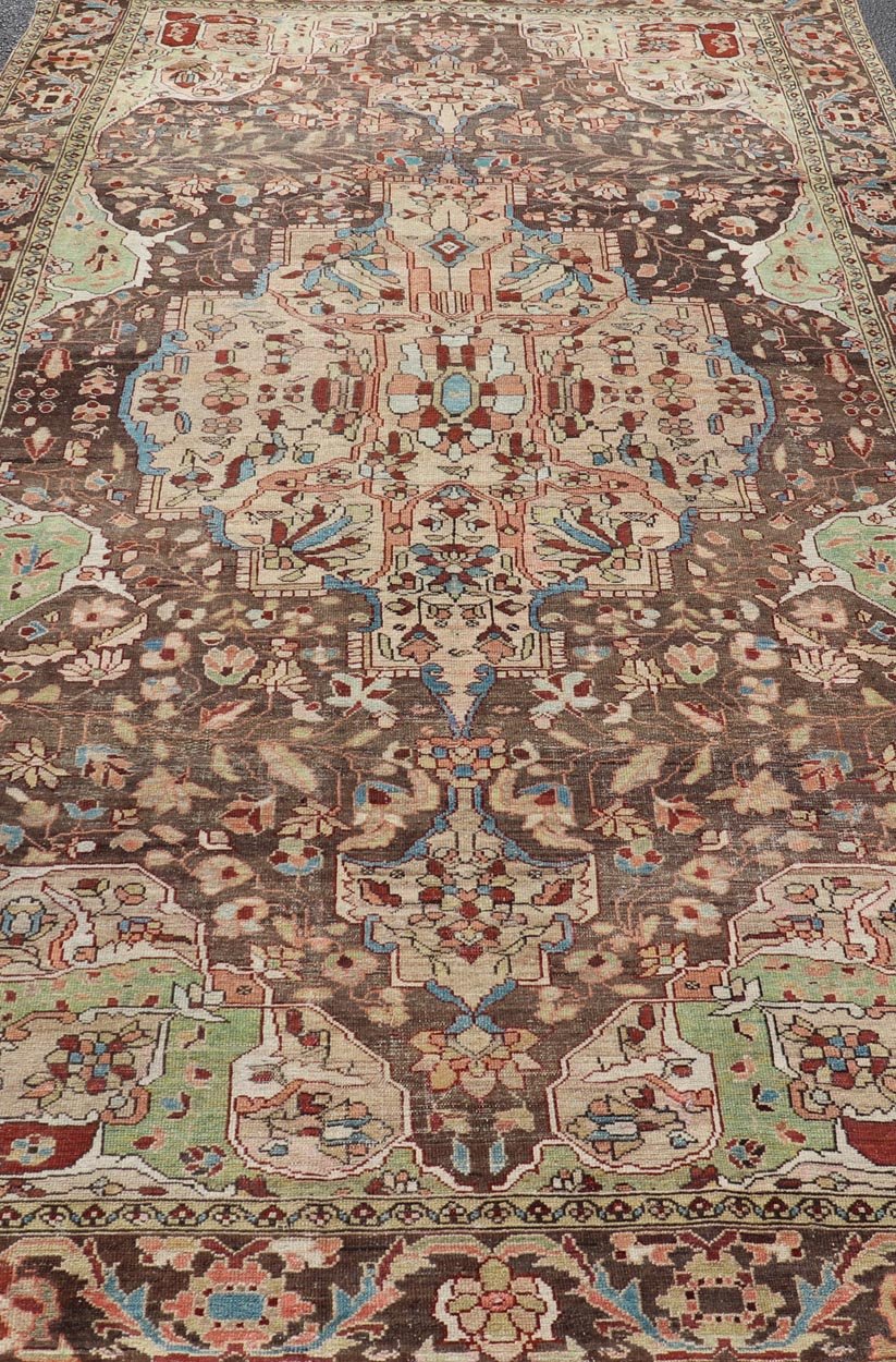 Antique Persian Malayer Gallery Rug with Large Floral Medallion With Soft Colors. Keivan Woven Arts / rug W22 - 0402 - 15478, country of origin / type: Iran / Malayer, circa 1920. Measures: 6'8 x 12'9 This multicolored Antique Persian Malayer wide g... - Keivan Woven ArtsW22 - 0402 - 15478 - 20091Rug