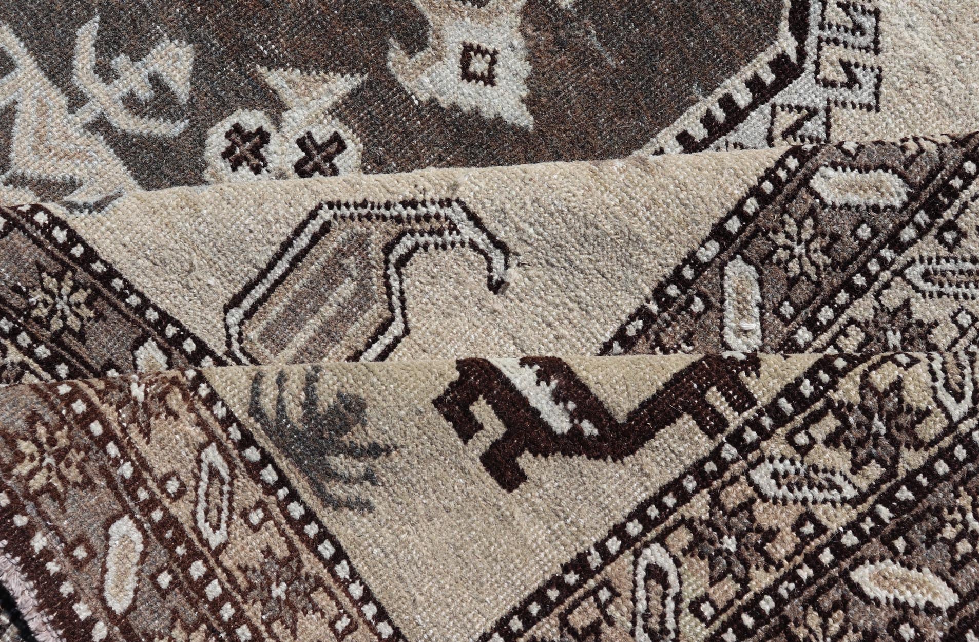 Persian Ardebil Carpet with three Octagon Medallions & Stylized Tribal Motifs. Vintage Ardebil carpet with Stylized tribal motifs in very Pale Green, Ivory, Mocha, Camel, Brown & Gray with three Octagon medallions. Keivan Woven Arts/ rug W22 - 0405, ... - Keivan Woven ArtsW22 - 0405 - 20109