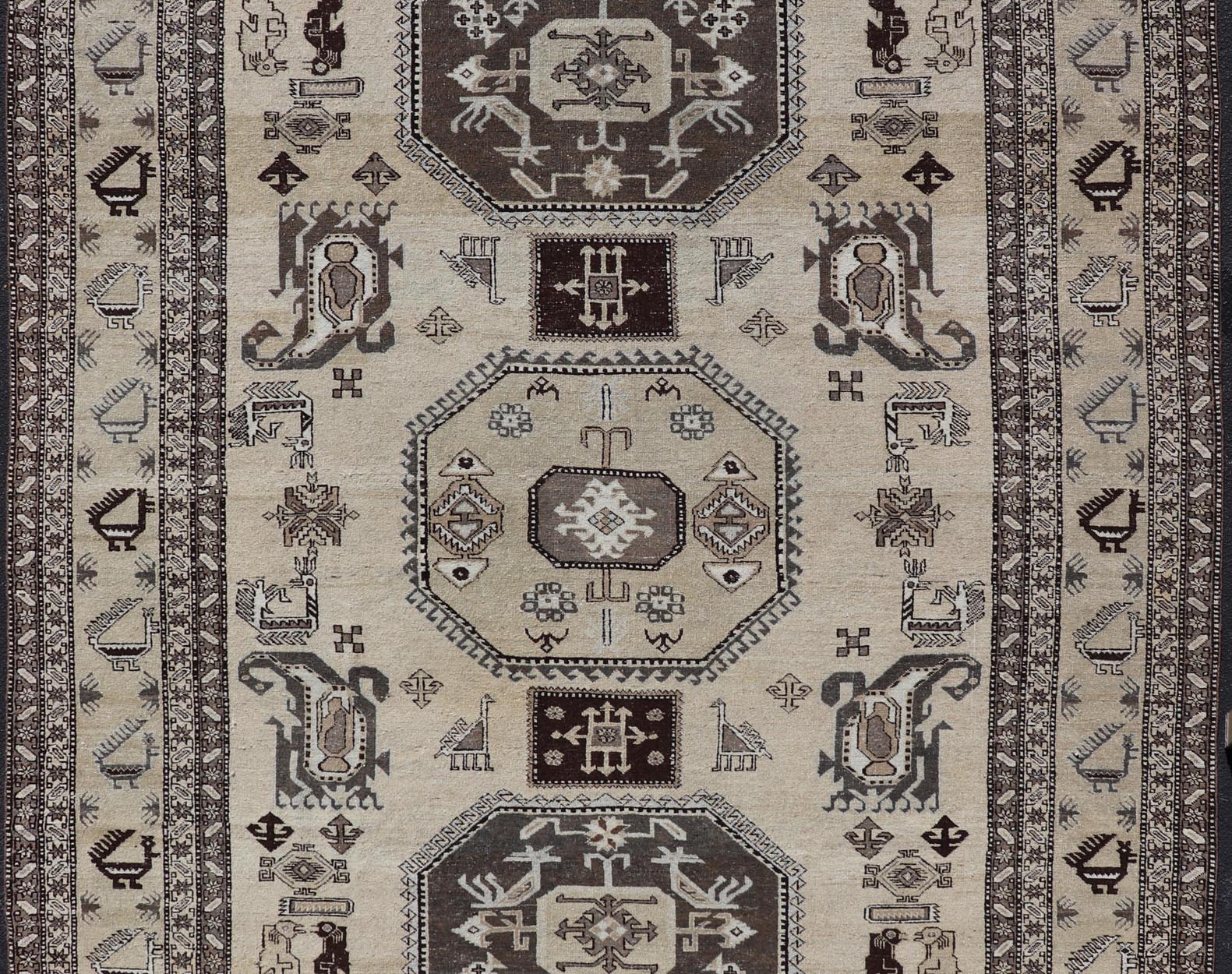 Persian Ardebil Carpet with three Octagon Medallions & Stylized Tribal Motifs. Vintage Ardebil carpet with Stylized tribal motifs in very Pale Green, Ivory, Mocha, Camel, Brown & Gray with three Octagon medallions. Keivan Woven Arts/ rug W22 - 0405, ... - Keivan Woven ArtsW22 - 0405 - 20109