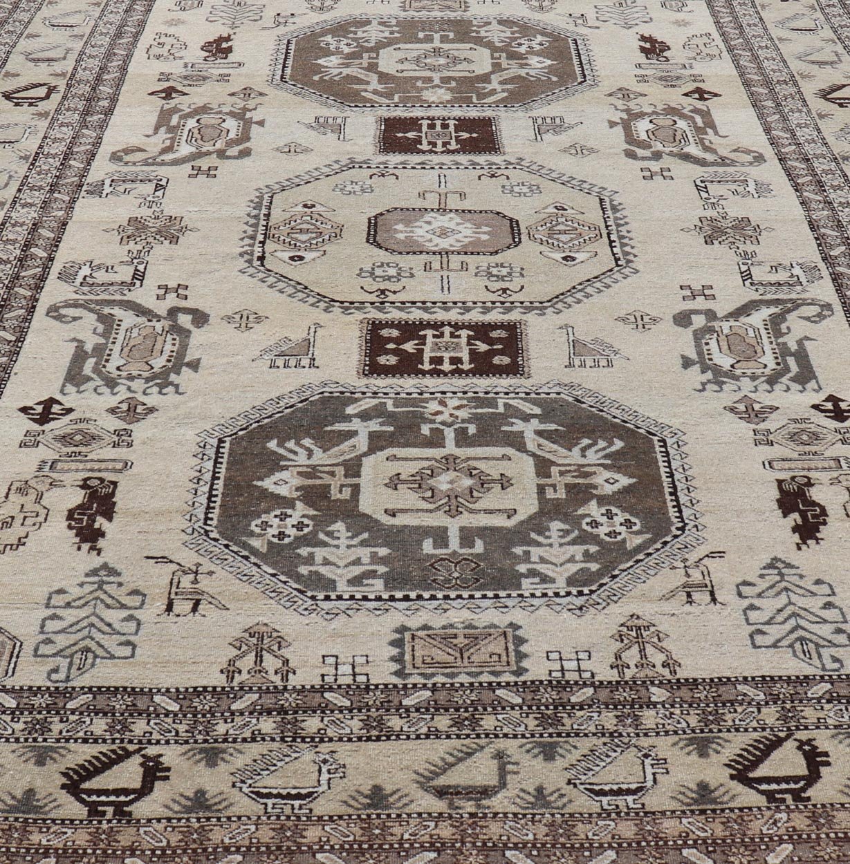 Persian Ardebil Carpet with three Octagon Medallions & Stylized Tribal Motifs. Vintage Ardebil carpet with Stylized tribal motifs in very Pale Green, Ivory, Mocha, Camel, Brown & Gray with three Octagon medallions. Keivan Woven Arts/ rug W22 - 0405, ... - Keivan Woven ArtsW22 - 0405 - 20109