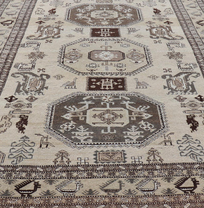 Persian Ardebil Carpet with three Octagon Medallions & Stylized Tribal Motifs. Vintage Ardebil carpet with Stylized tribal motifs in very Pale Green, Ivory, Mocha, Camel, Brown & Gray with three Octagon medallions. Keivan Woven Arts/ rug W22 - 0405, ... - Keivan Woven ArtsW22 - 0405 - 20109Rug