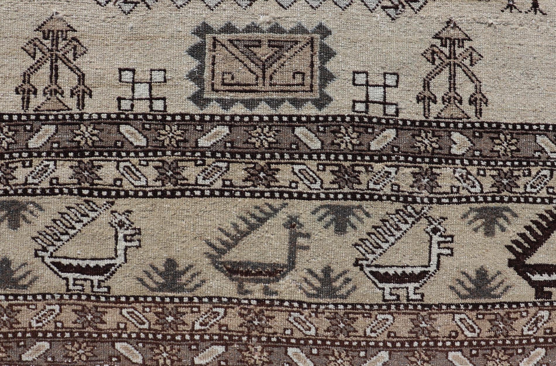 Persian Ardebil Carpet with three Octagon Medallions & Stylized Tribal Motifs. Vintage Ardebil carpet with Stylized tribal motifs in very Pale Green, Ivory, Mocha, Camel, Brown & Gray with three Octagon medallions. Keivan Woven Arts/ rug W22 - 0405, ... - Keivan Woven ArtsW22 - 0405 - 20109