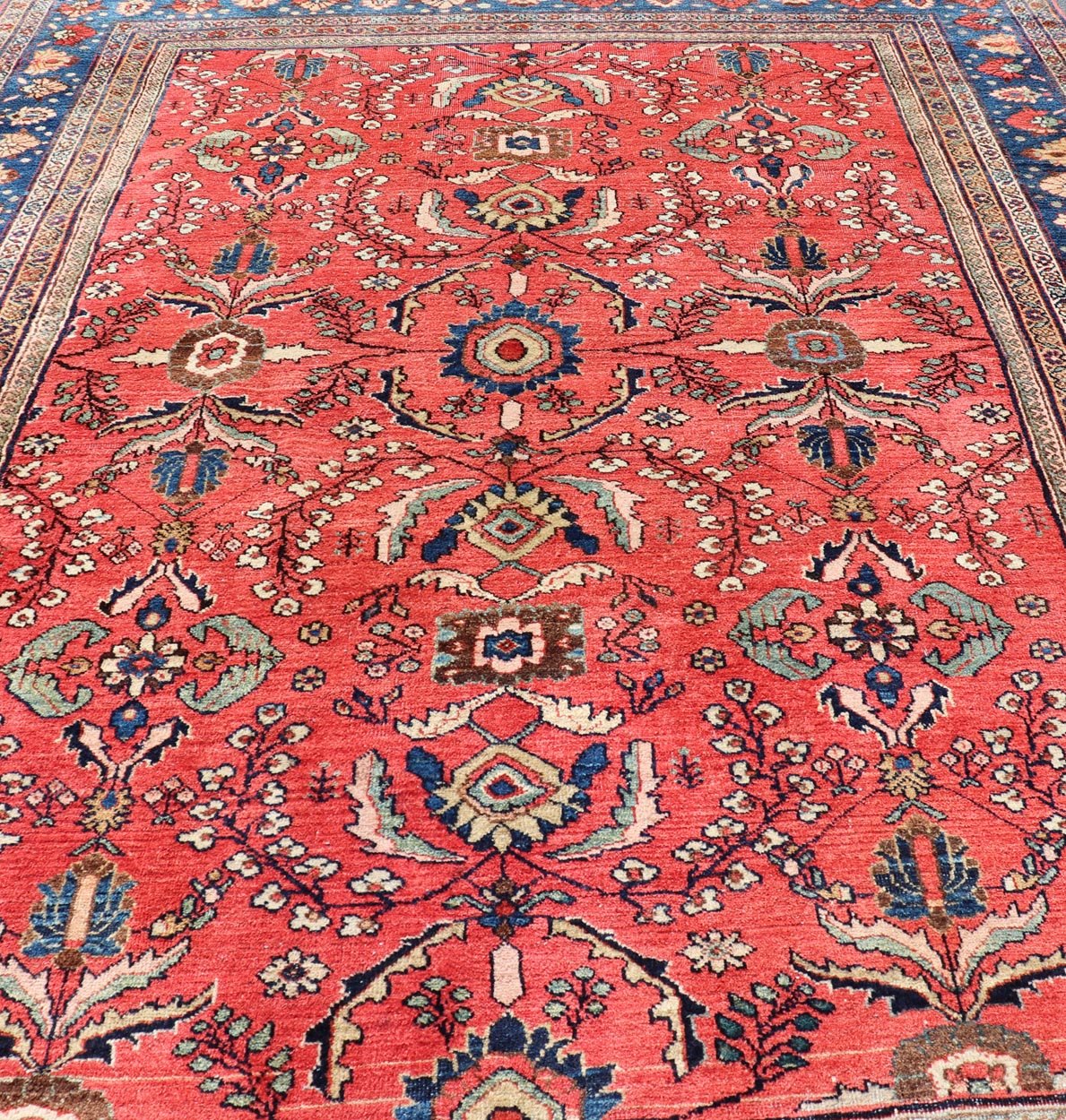 Antique Hand Knotted Persian Mahal Sultanabad rug with All - Over Florals On soft Red Filed and Royal blue border. Antique Hand Knotted Persian Mahal Sultanabad rug. Keivan Woven Arts/ rug/ W22 - 0804, country of origin / type: Iran / Mahal, circa 1... - Keivan Woven ArtsW22 - 0804 - 21559Rug