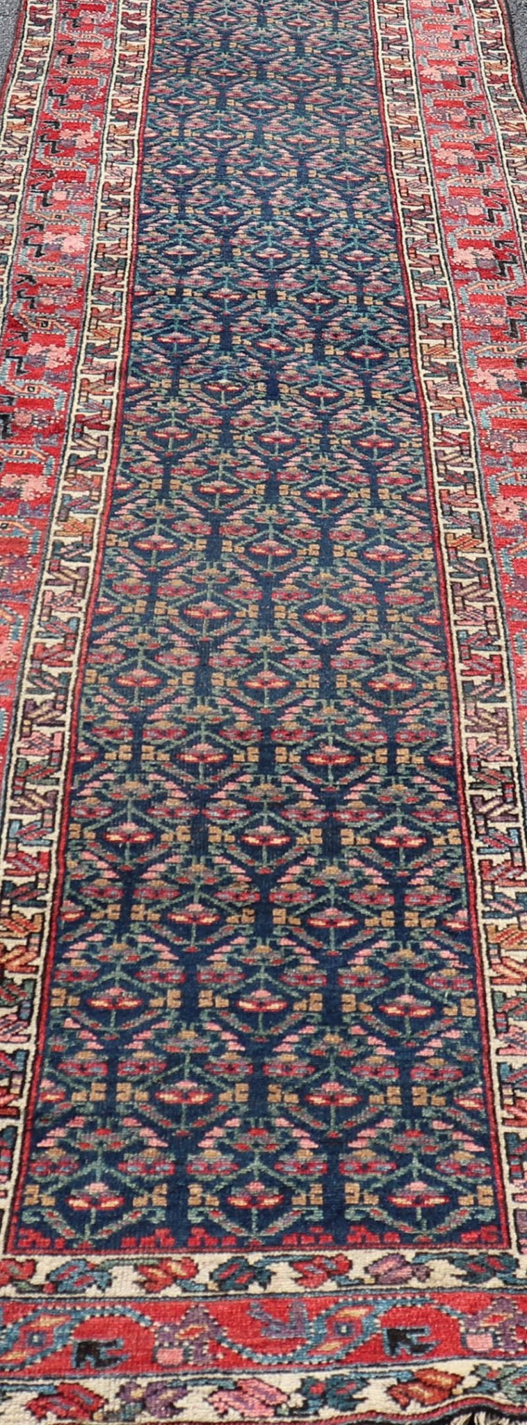 Measures: 3'6 x 17'3 Antique N.W. Persian Runner with Geometric Florals in Dark Blue and Red's. Keivan Woven Arts / rug W22 - 1003, country of origin / type: Iran / N.W. Persian Tribal, circa 1920. This Northwest Persian runner features a deep... - Keivan Woven ArtsW22 - 1003 - 21693Rug
