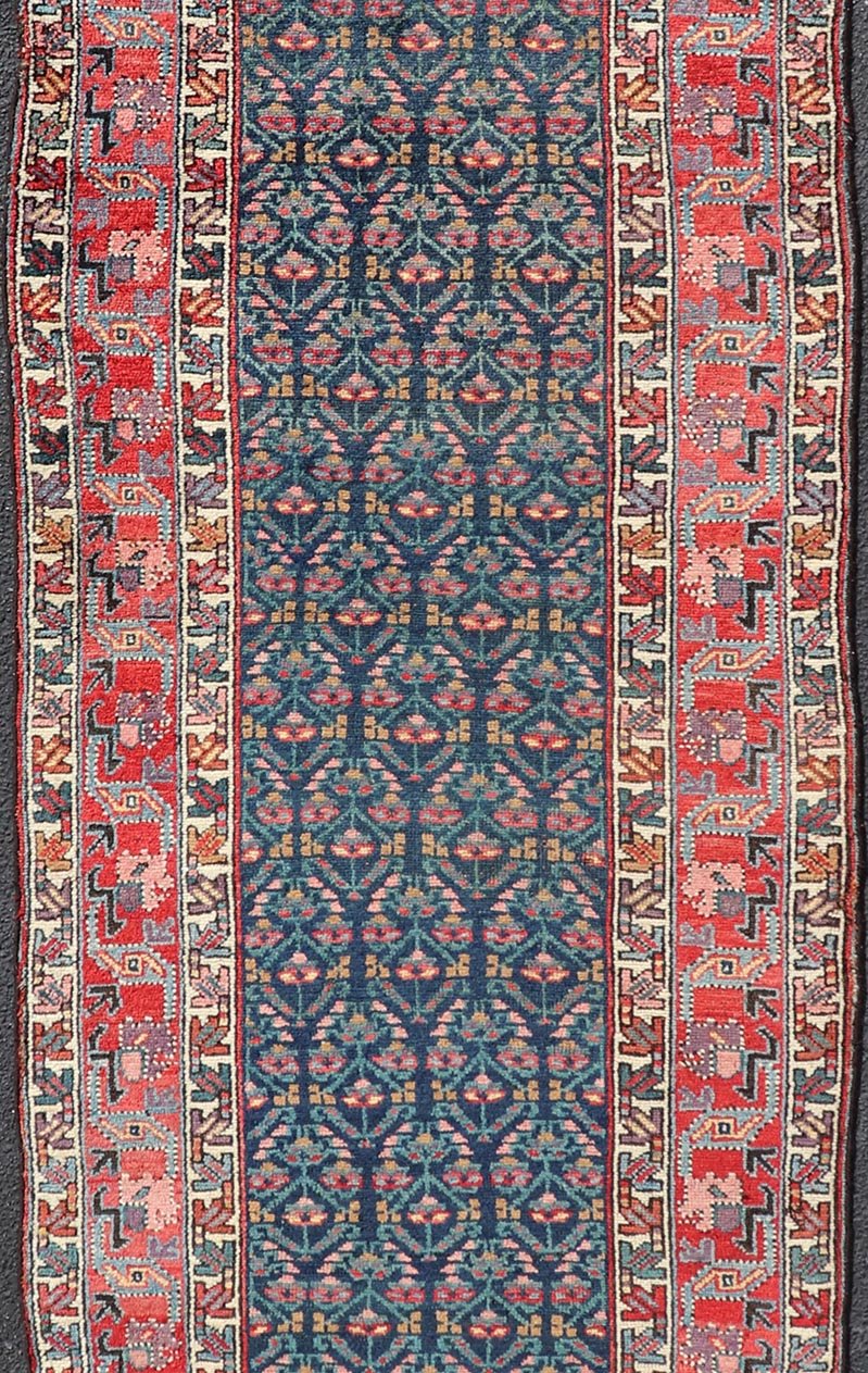 Measures: 3'6 x 17'3 Antique N.W. Persian Runner with Geometric Florals in Dark Blue and Red's. Keivan Woven Arts / rug W22 - 1003, country of origin / type: Iran / N.W. Persian Tribal, circa 1920. This Northwest Persian runner features a deep... - Keivan Woven ArtsW22 - 1003 - 21693Rug
