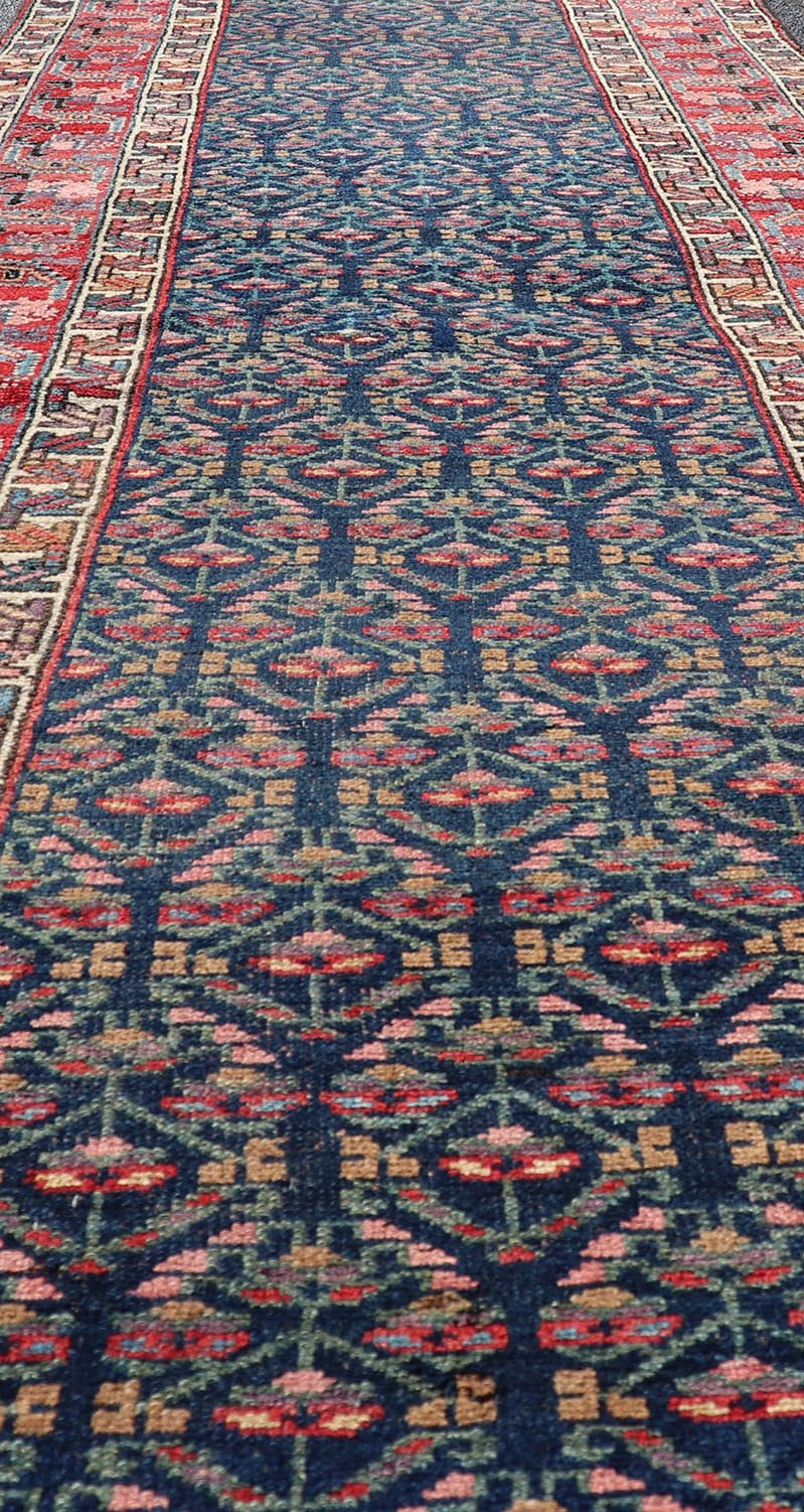 Measures: 3'6 x 17'3 Antique N.W. Persian Runner with Geometric Florals in Dark Blue and Red's. Keivan Woven Arts / rug W22 - 1003, country of origin / type: Iran / N.W. Persian Tribal, circa 1920. This Northwest Persian runner features a deep... - Keivan Woven ArtsW22 - 1003 - 21693Rug