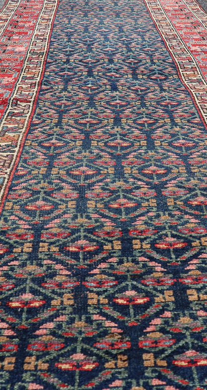 Measures: 3'6 x 17'3 Antique N.W. Persian Runner with Geometric Florals in Dark Blue and Red's. Keivan Woven Arts / rug W22 - 1003, country of origin / type: Iran / N.W. Persian Tribal, circa 1920. This Northwest Persian runner features a deep... - Keivan Woven ArtsW22 - 1003 - 21693Rug