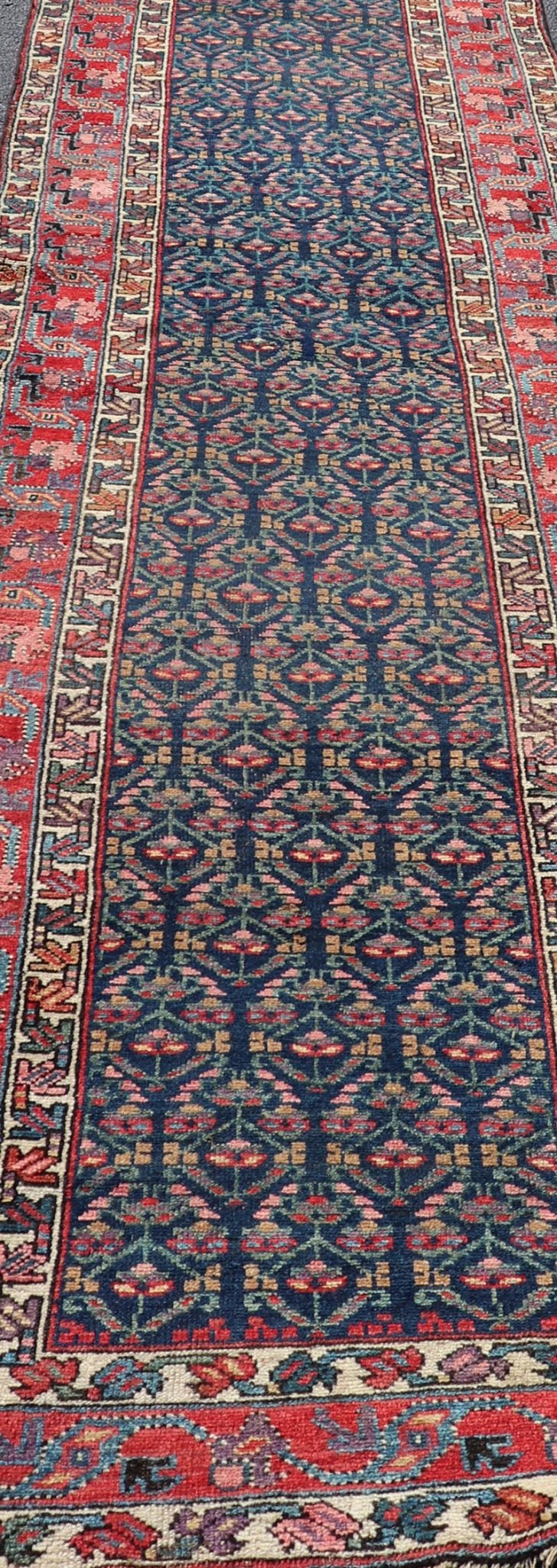 Measures: 3'6 x 17'3 Antique N.W. Persian Runner with Geometric Florals in Dark Blue and Red's. Keivan Woven Arts / rug W22 - 1003, country of origin / type: Iran / N.W. Persian Tribal, circa 1920. This Northwest Persian runner features a deep... - Keivan Woven ArtsW22 - 1003 - 21693Rug