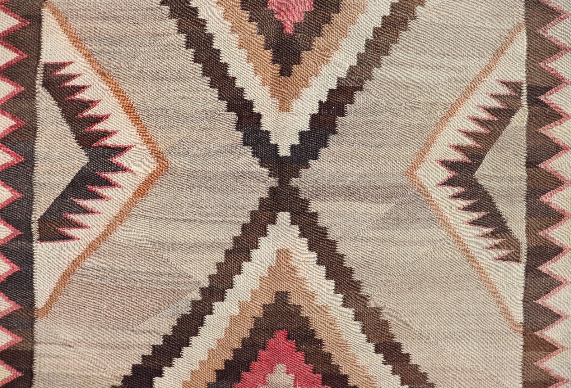 Vintage Large hand Woven Navajo Rug in Gray, Ivory, Black, Brown's, and Red. Keivan Woven Arts rug X23 - 0107, country of origin / type: America / Navajo, circa 1930 Measures: 4'4 x 6'3 This intriguing vintage Navajo rug was woven in the Navajo ar... - Keivan Woven ArtsX23 - 0107 - 23524Rug