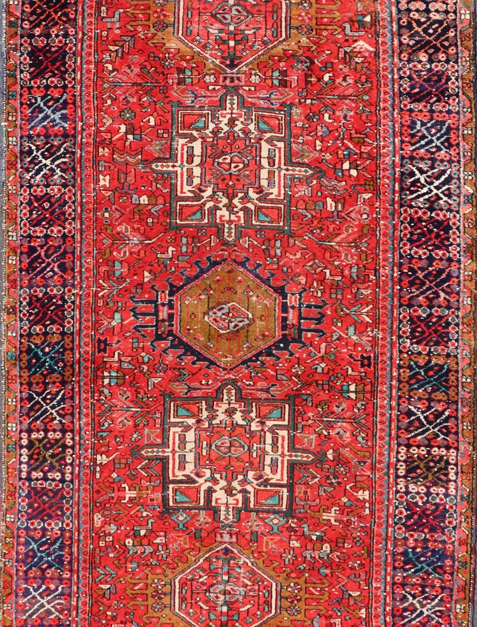 Vintage Persian Karajeh - Heriz Gallery with Geometric Medallions On A Red Ground. Keivan Woven Arts , rug X23 - 0109, country of origin / type: Persian / Heriz - Karajeh, circa mid - 20th century. Measures: 5'0 x 12'4 This gallery rug incorporates a di... - Keivan Woven ArtsX23 - 0109 - 24354Rug